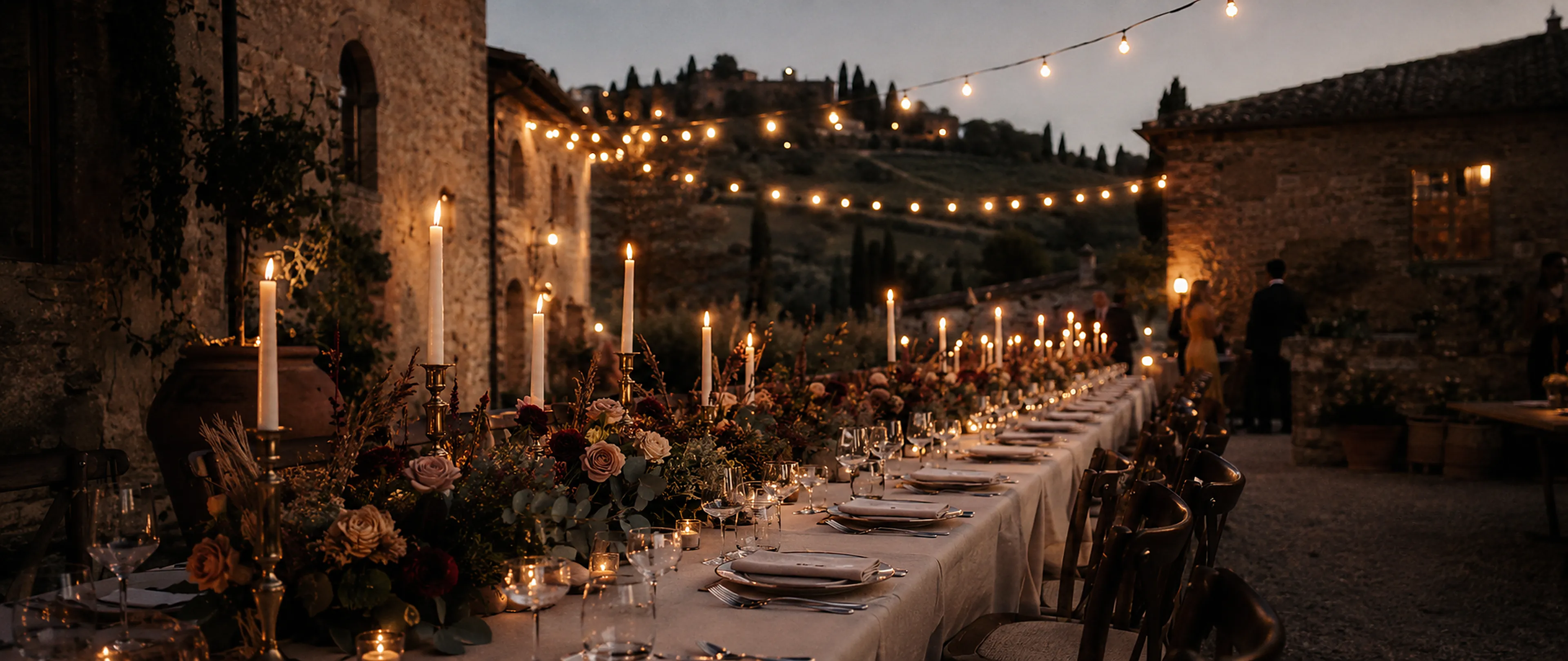 A Tuscan estate and cypress trees at dusk